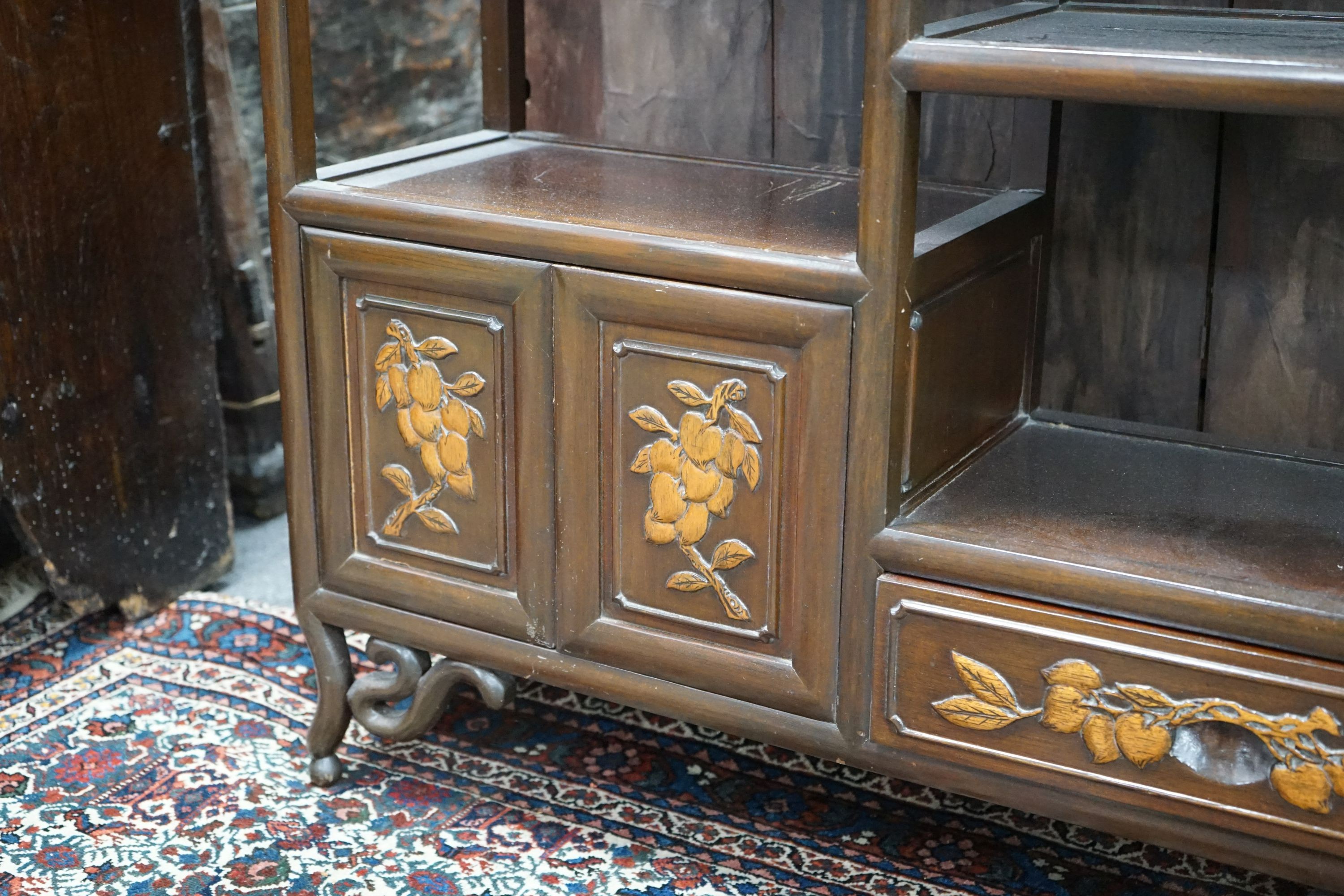 A Chinese elm tiered side cabinet, width 81cm, depth 26cm, height 91cm